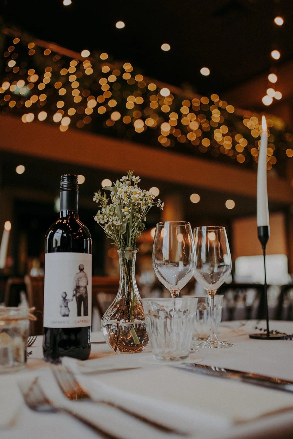 Elegantly set dining table with wine and flowers, creating a romantic atmosphere for private events at The Admiral Hardy in Greenwich.