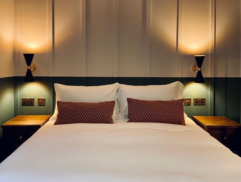Room with teal headboard detail