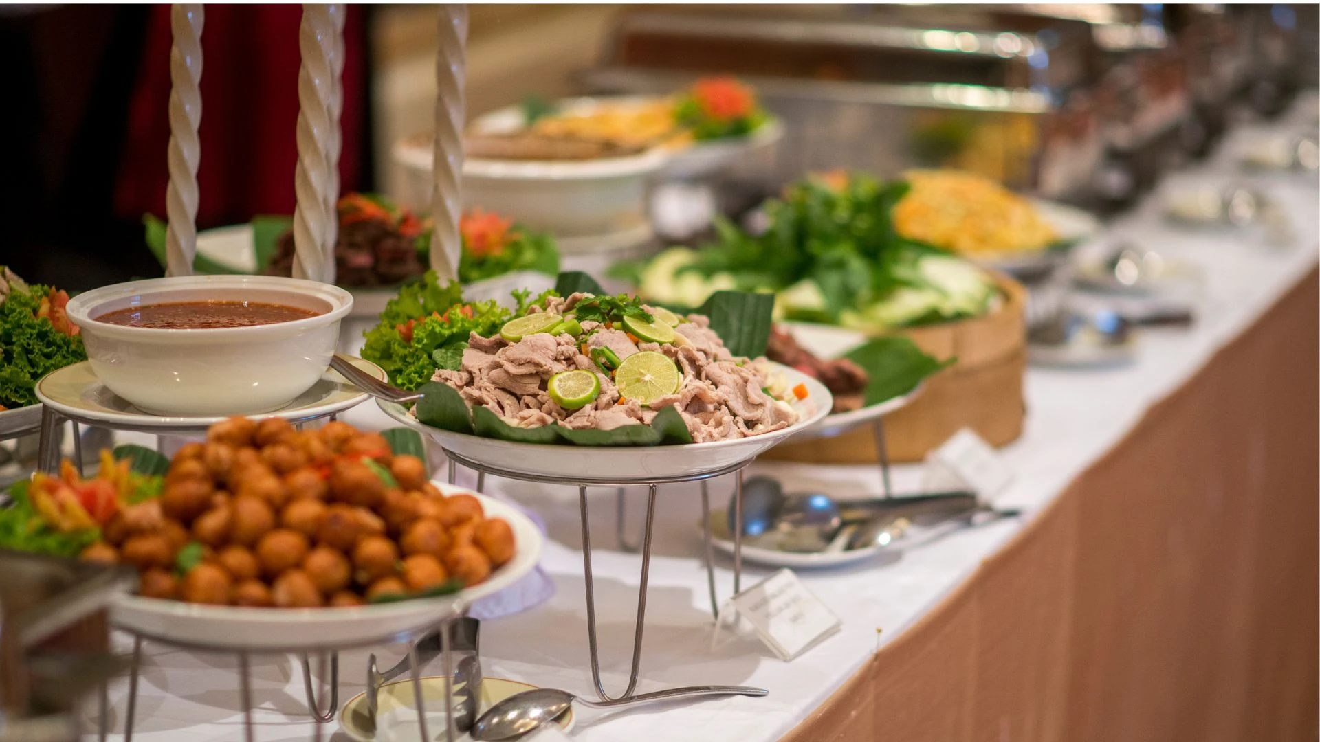 A well-prepared and appetizing buffet table at Clarence Hall, featuring a variety of dishes perfect for a wedding reception.